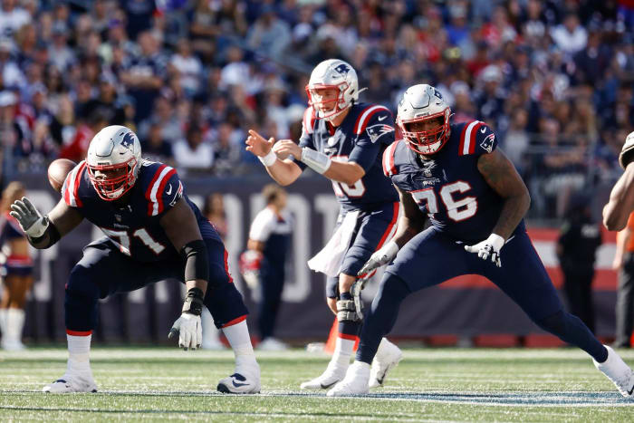 Patriots OL Michael Onwenu (71) and Isaiah Wynn (76)